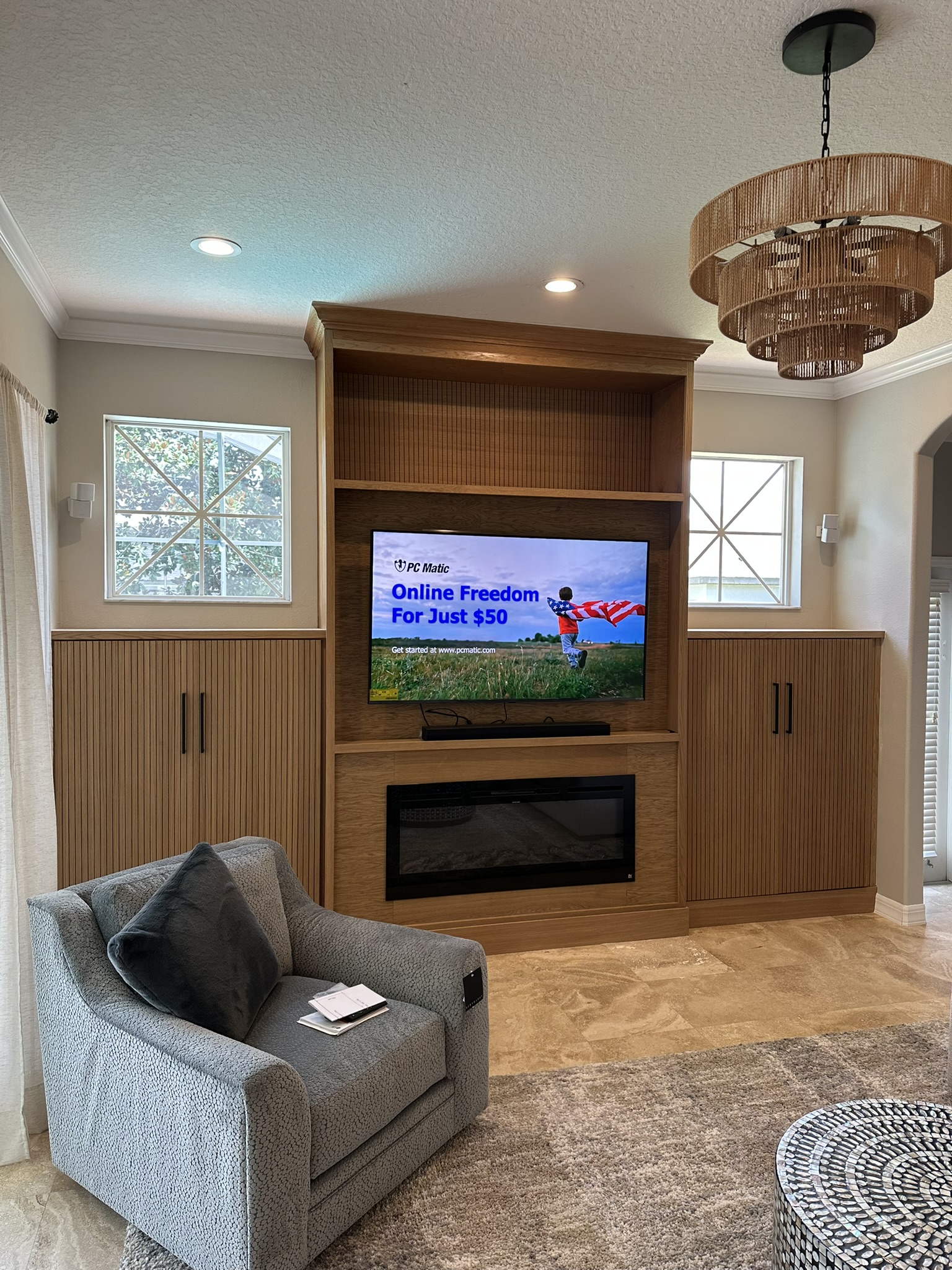 Wood slatted media wall with fireplace and TV